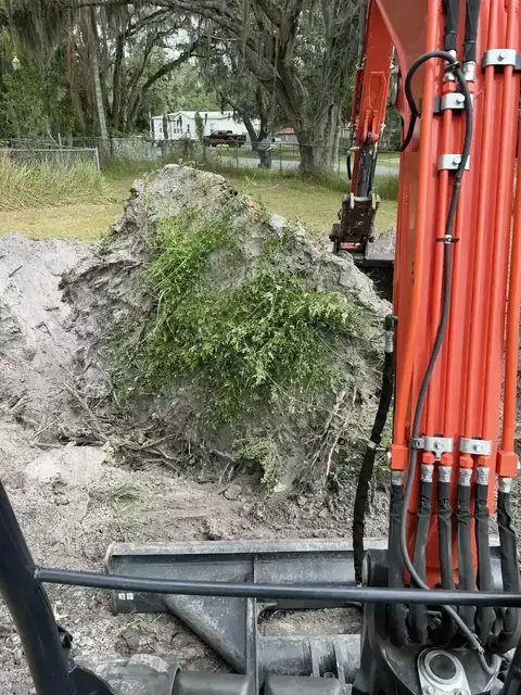 Kubota equipment during overgrowth removal and land clearing in Polk County