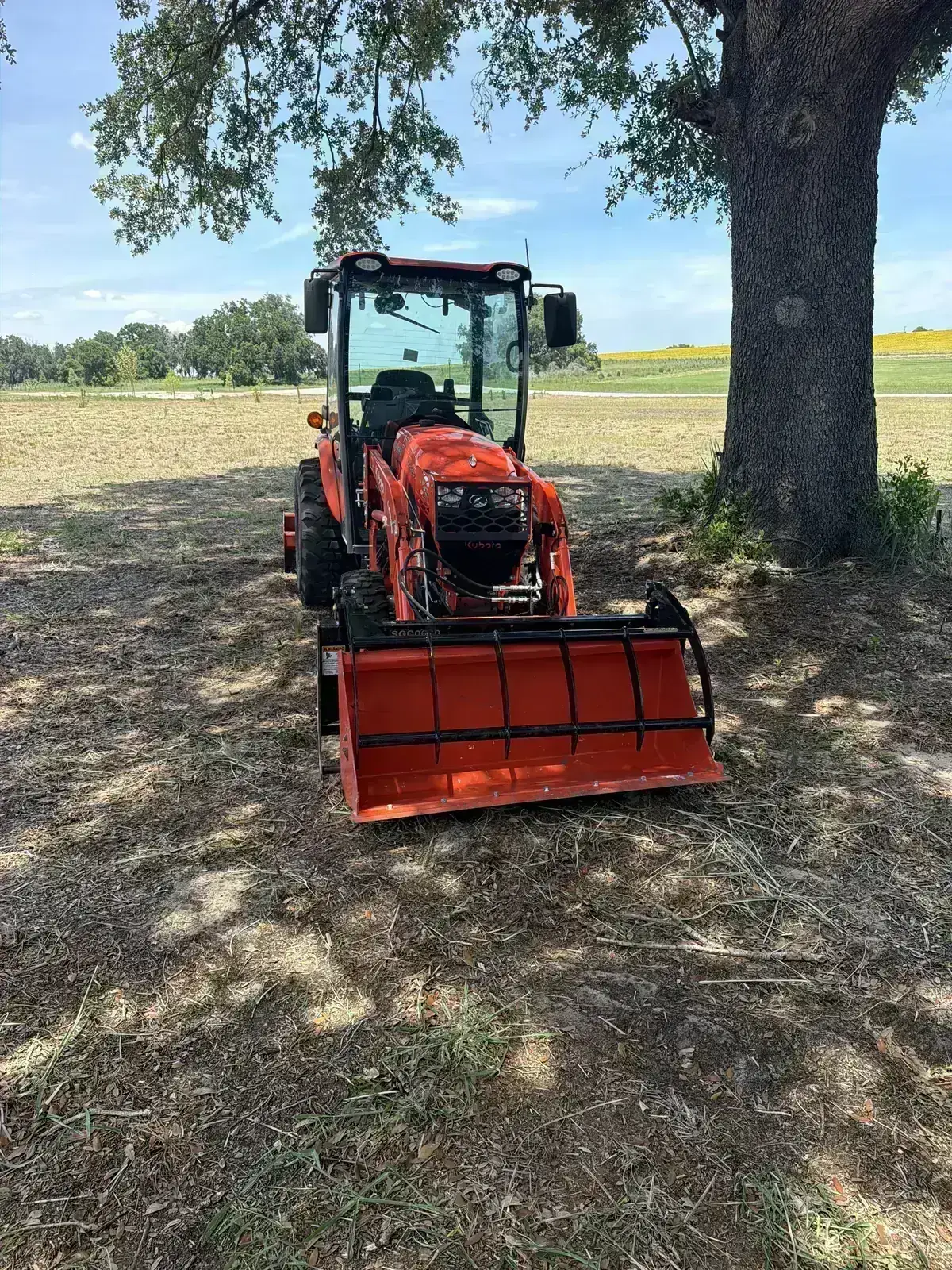 Kubota compact tractor with loader attachment on a Central Florida job site