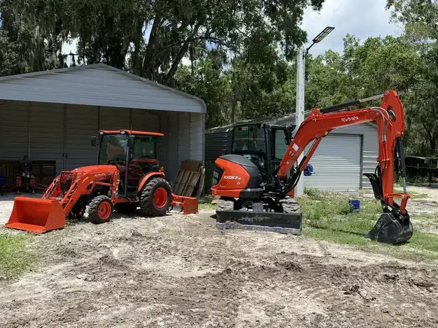 Faith Works Kubota fleet and trailers ready for a Polk County job