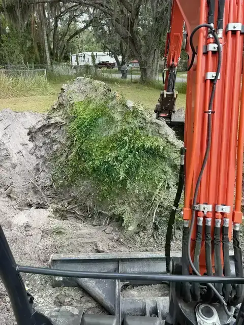 Kubota equipment during overgrowth removal and land clearing in Polk County
