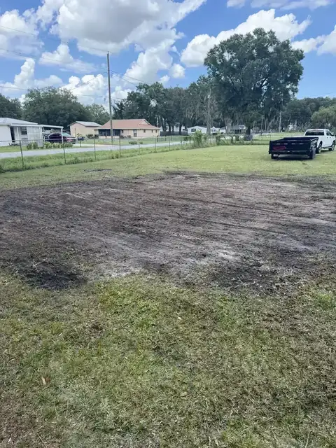 Property after brush clearing with soil ready for leveling and cleanup