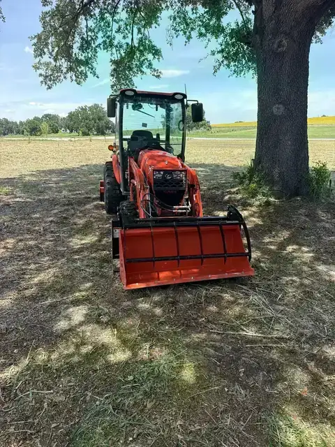Kubota compact tractor with loader attachment on a Central Florida job site